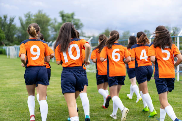 istock Ladies soccer players jogging 1252954967