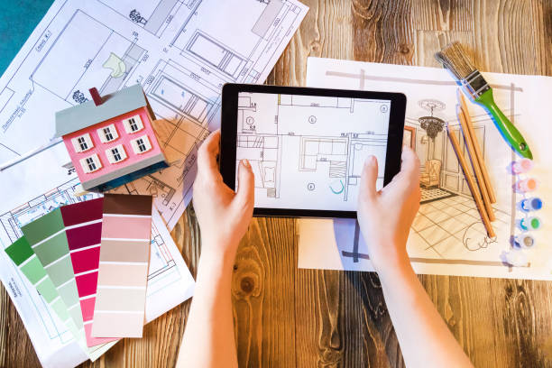 istock Flatlay interior designer with tablet pad and plans and art tools 1252956841