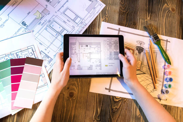 istock Flatlay interior designer with tablet pad and plans and art tools 1252956847