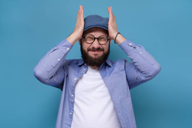 istock Caucasian mature man holding hands on head feeling very upset and stressed 1252957693