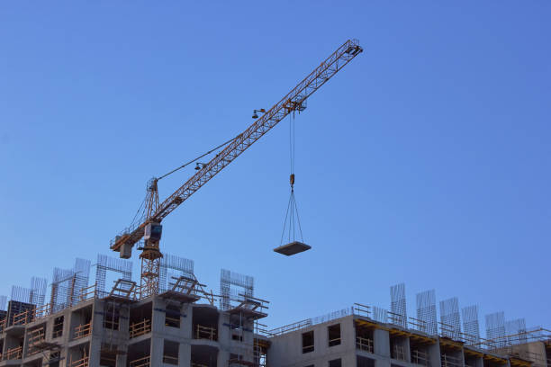 istock Industrial construction cranes the construction of an building 1252960354