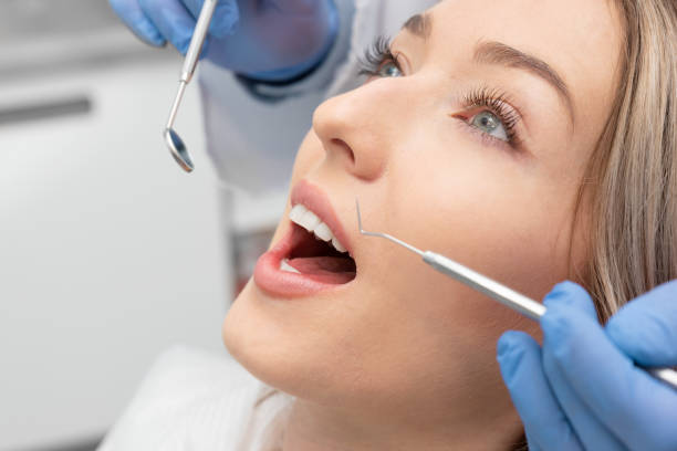 istock Woman having teeth examined at dentists 1252961983
