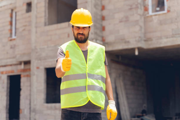 istock Worker at a construction site with thumbs up and self-confident 1252963730