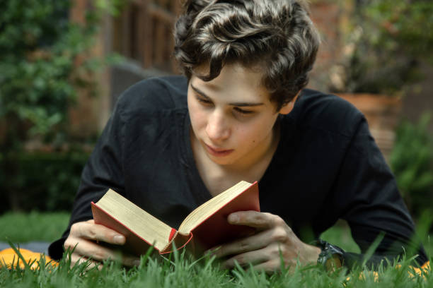 istock Young adult reading 1252965323