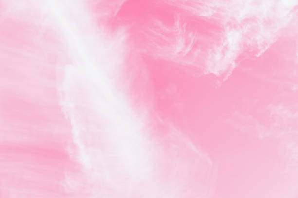 istock Pink sky background with soft delicate white clouds. Copy space. Romantic background 1252970669