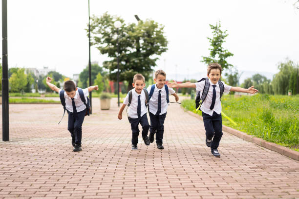 istock Little boy running to school 1252975949