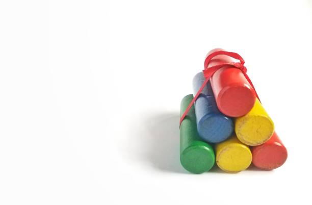 Wooden colours toy for kids learning basic colours and counting with red, yellow, blue and green packed together with red ribbon.