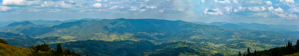 Panorama of mountains covered with green forests
