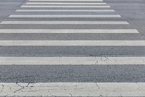 Zebra crossing traffic sign outside on asphalt in an urban city street