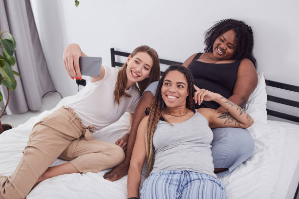 istock Three diverse ladies posing for photo on phone 1252992668