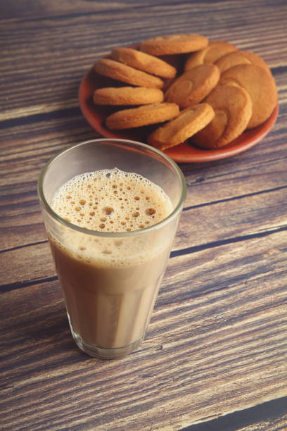 istock Cup of Tea on wooden table with Butter biscuits 1253001060