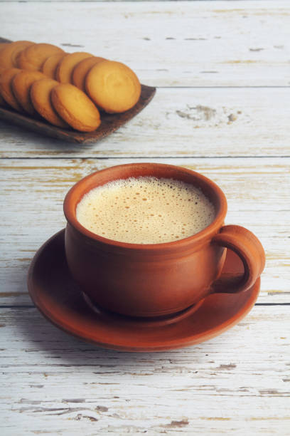 istock Cup of Tea on wooden table with Butter biscuits 1253001076