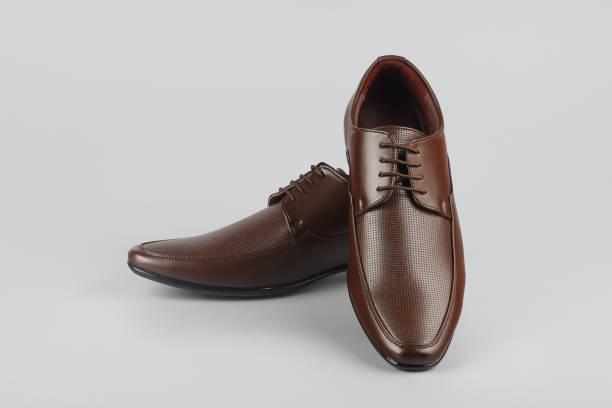 istock Men's formal leather Shoes isolated on gray 1253001110
