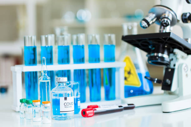 istock Chemical test tubes and blood sample. 1253001632