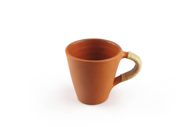 istock Indian made traditional terracotta coffee cup on white background 1253001643