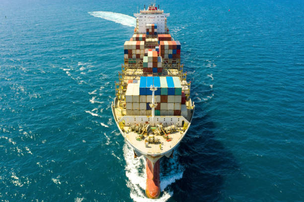 istock Large loaded container Ship cruising slowly at Sea. 1253001814