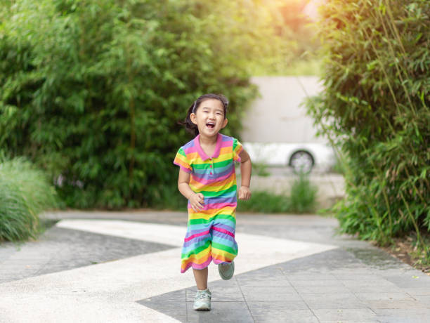 istock Cute little Girl Running 1253005062