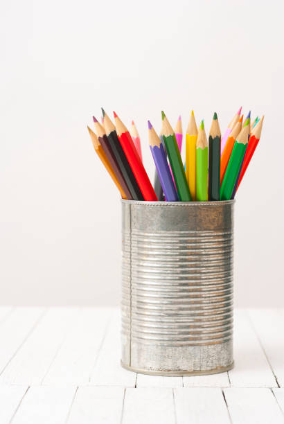 istock Colored pencils on wooden table 1253005886