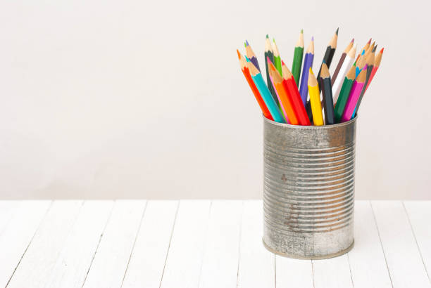 istock Colored pencils on wooden table 1253005892