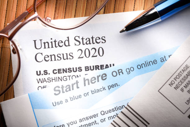 Census 2020: survey questionnaire form on desk with pen