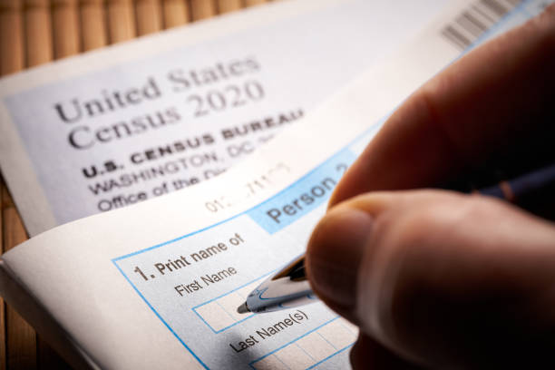 Census 2020: survey questionnaire form on desk with pen