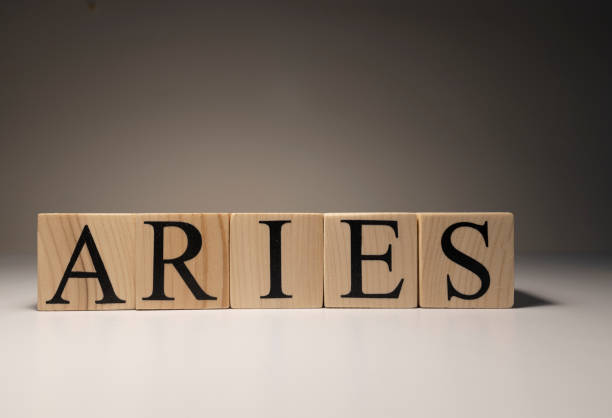 istock Aries word on wooden cubes on white background. 1253009165