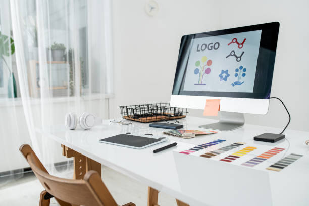 istock Computer monitor, graphics tablet with stylus, headphones and other stuff 1253009374