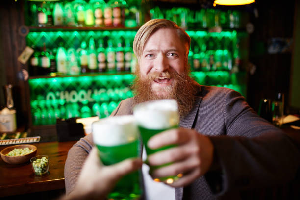 istock Clinking with glasses of beer 1253009516
