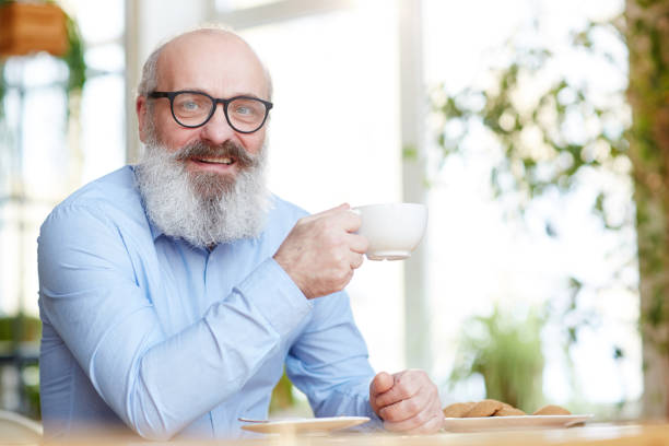 istock Man with cup of tea 1253009554