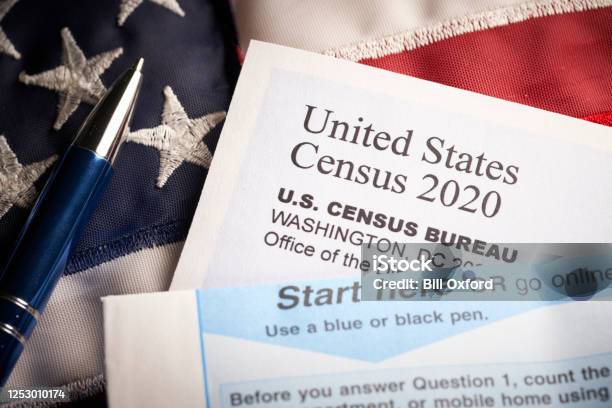 Census 2020 Survey Questionnaire Form On Desk With Pen And Usa Flag Stock Photo - Download Image Now