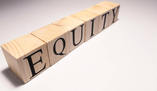 istock Equity Word Written In Wooden Cube. Close up. 1253010241