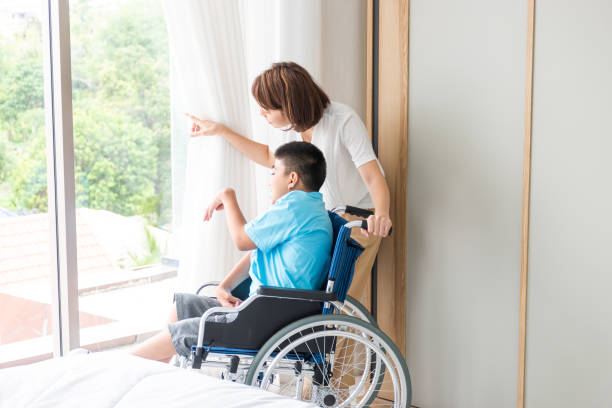 istock woman taking care disabled child 1253010260