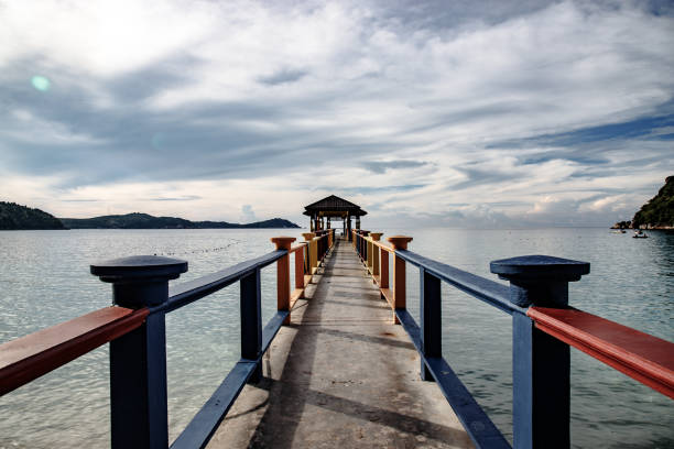 istock Walkway of a tropical island harbor 1253015590