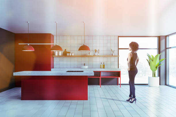 istock African woman in modern white and red kitchen 1253019572