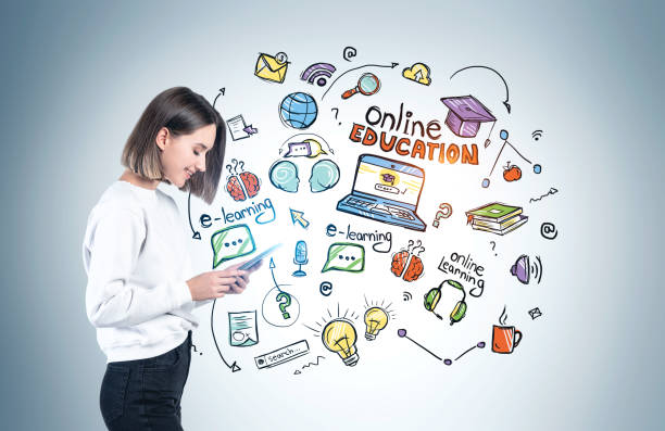 istock Smiling woman with phone, online education 1253019809