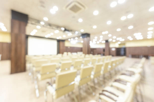 istock Blurred photo of empty interior of conference holl 1253021380
