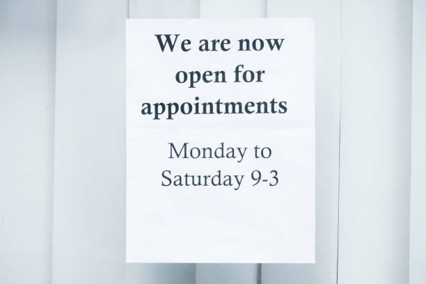 istock Social distancing sign for shop customer queue 1253023776