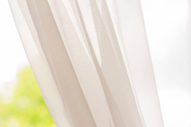 istock Curtain on the window.The window with the curtain drawn back. 1253024019