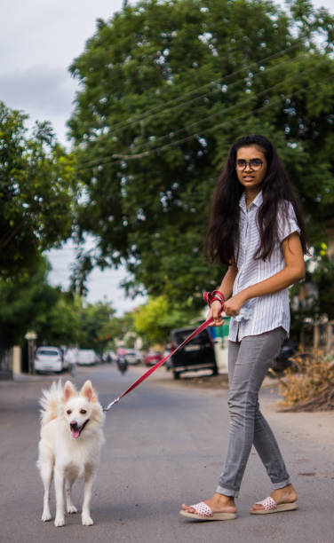 istock Girl with dog 1253025048