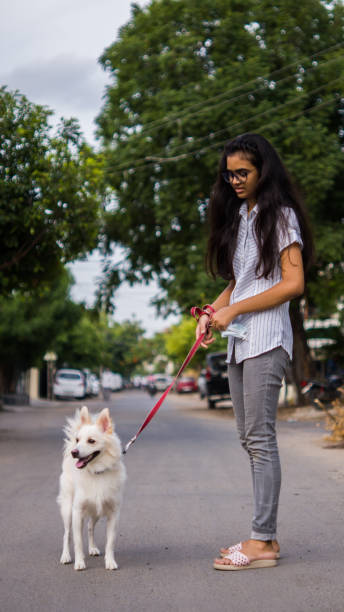 istock Girl with dog 1253025120
