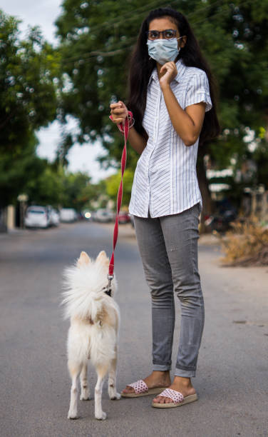 istock Girl with dog 1253025280