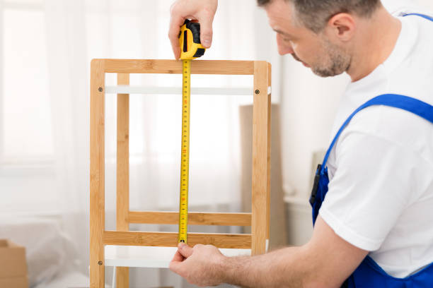 istock Professional Carpenter Measuring Shelf With Tape Working Indoor 1253025532