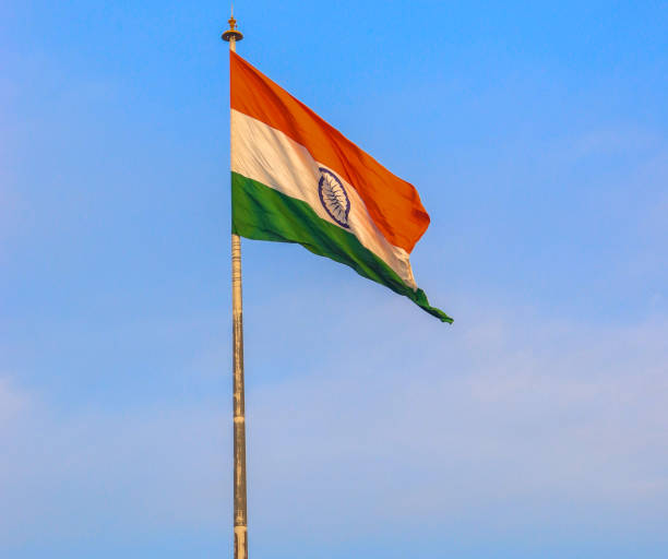 istock india flag with clear blue sky in the background 1253026917