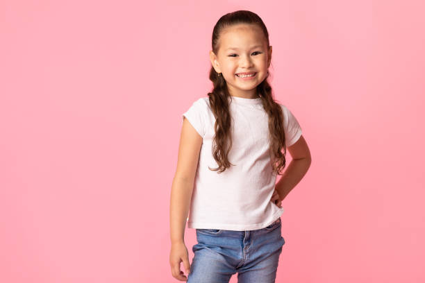 istock Happy asian girl posing and looking at camera 1253026930