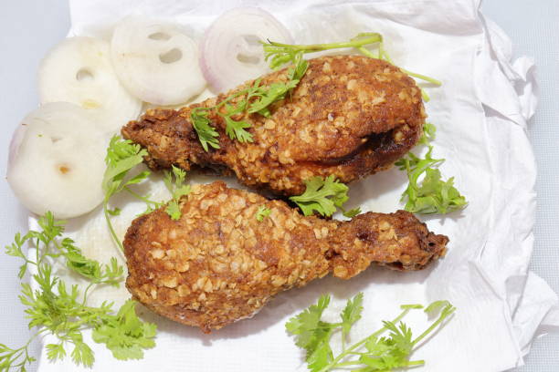 Hot and crispy fried chicken legs isolated on a white background