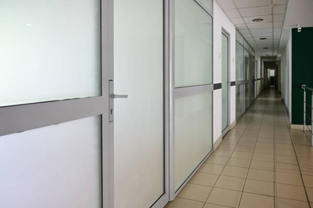 istock Photo of a corridor with white doors inside the building 1253029574