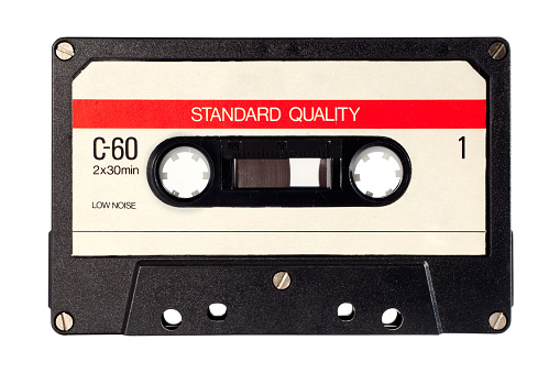 Close up of a vintage music audio tape on white background