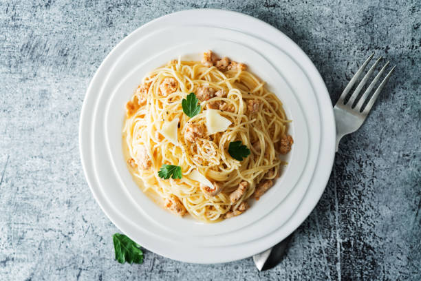 istock Ground chicken or turkey pasta in a white plate 1253030841
