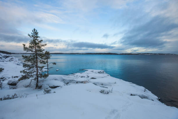 Rocky shore of Lake Ladoga. Leningrad region, Russia Rocky shore of Lake Ladoga. Leningrad region winter landscape, Russia republic of karelia russia stock pictures, royalty-free photos & images