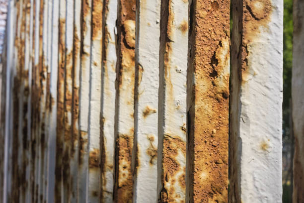 istock Rusted white metal background. Rusty white metal fence 1253036911